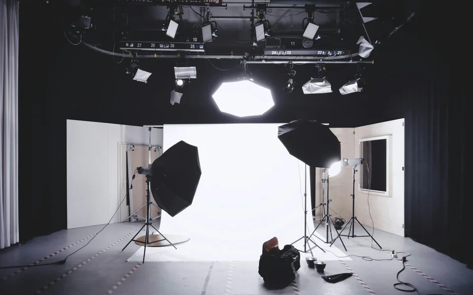 Camera and lighting equipment in a photography studio.
