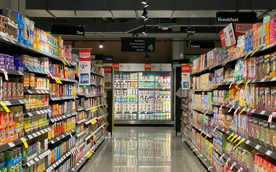 Stocked aisles inside a grocery store.